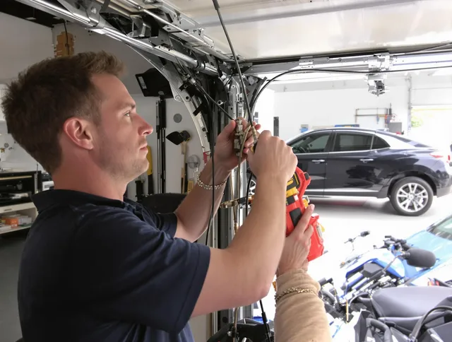 Westminster Garage Door Repair safety certified technician performing cable replacement in Westminster
